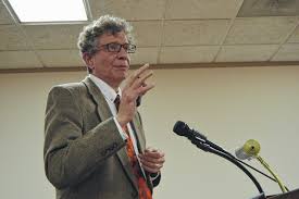 Photo of Jeff Adolphsen speaking at a podium