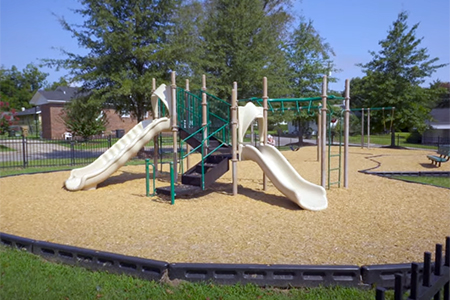 Playground set in the park fence