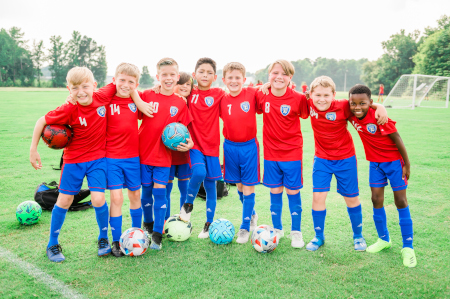 Young boys soccer league lined up for a end a game photo shoot