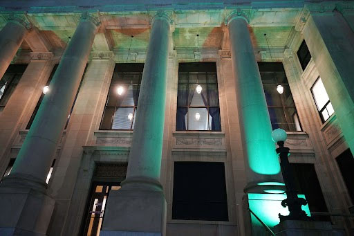Johnston County Courthouse lit up with green floodlights